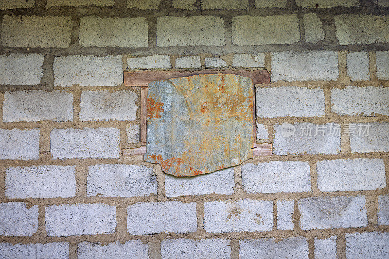 Window closed with a piece of corrugated iron